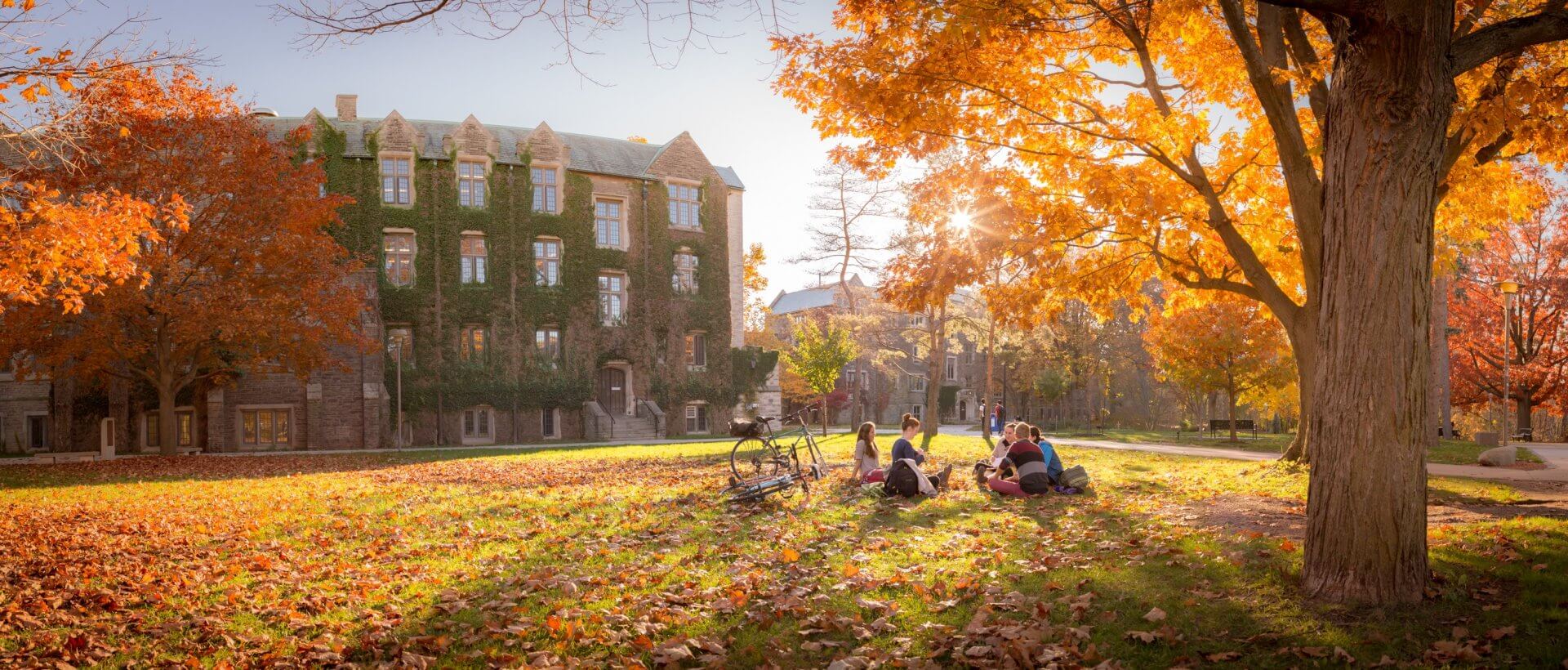 Students sitting on outside on campus