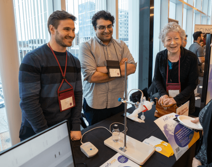 AeroVax startup founders with community members at entrepreneurship event.