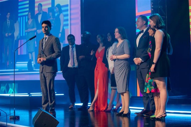 McMaster staff on stage during Canadian Event Award speech.
