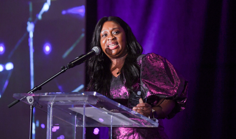 Black Student Success Centre manager Faith receiving Onyx award.