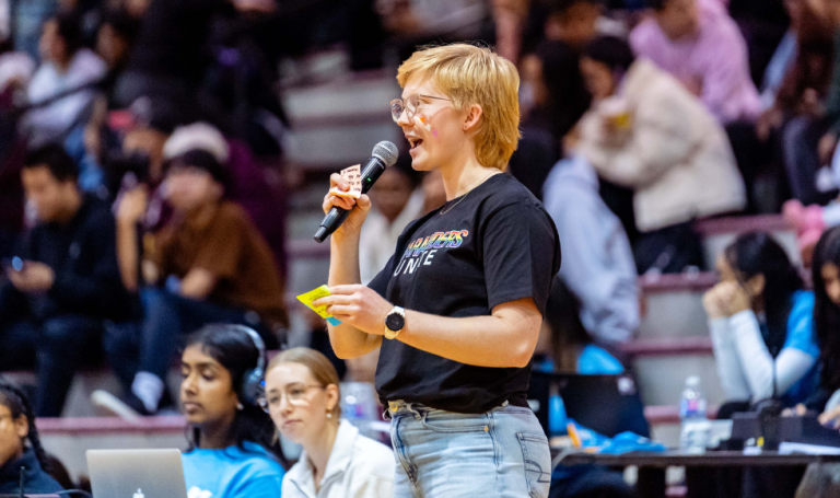 Vice-president of events for the McMaster LGBTQ2SIA+ Athletic Advocacy Group at Pride game.
