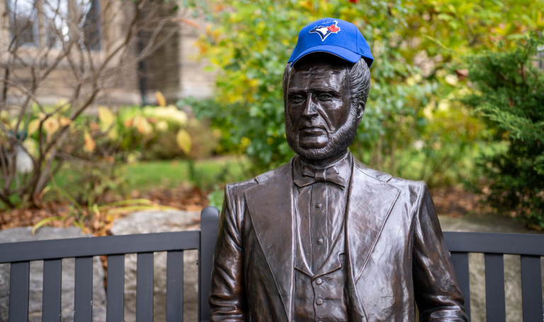 Senator McMaster statue wearing Blue Jays hat.