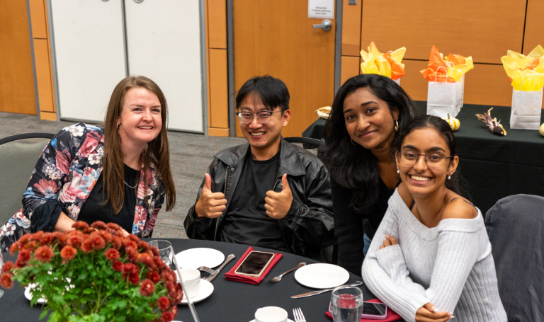 Table of students at Harvest Dinner.