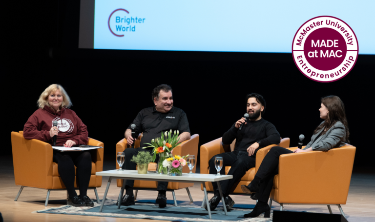 Panelists on stage at entrepreneurship event.
