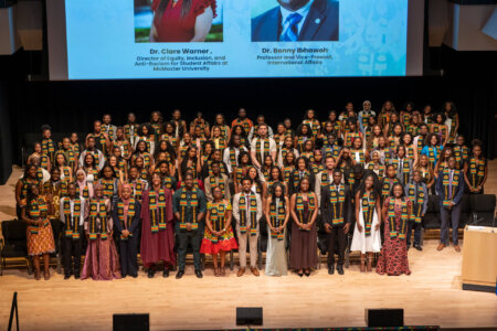 Graduating class on stage at Black Excellence Graduate Celebration