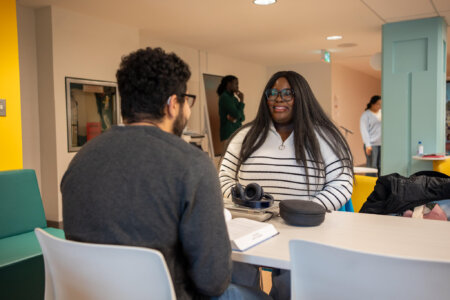 Students in library study space.