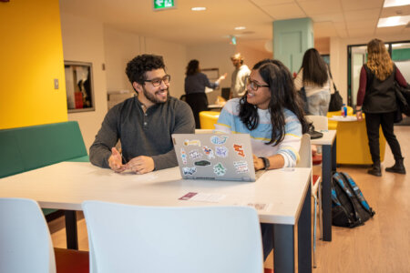 Students in library study space.