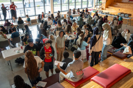 Large group of students at crafting event.