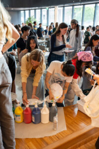 Large group of students at crafting event.