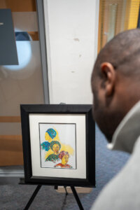 Community member looking at artwork