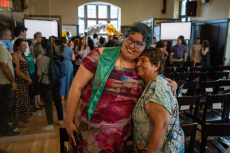 Graduate and family during Latin American Graduate Celebration