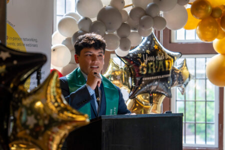 Graduate making speech during Latin American Graduate Celebration